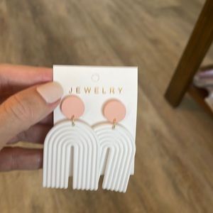 Brand new 2 1/2 inch textured U shape white and light pink earrings.
